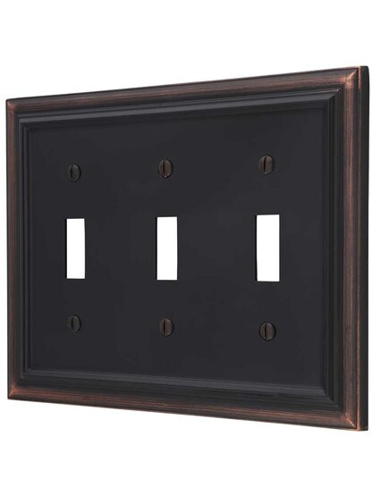 Georgian Triple-Toggle Switch Plate in Aged Bronze.
